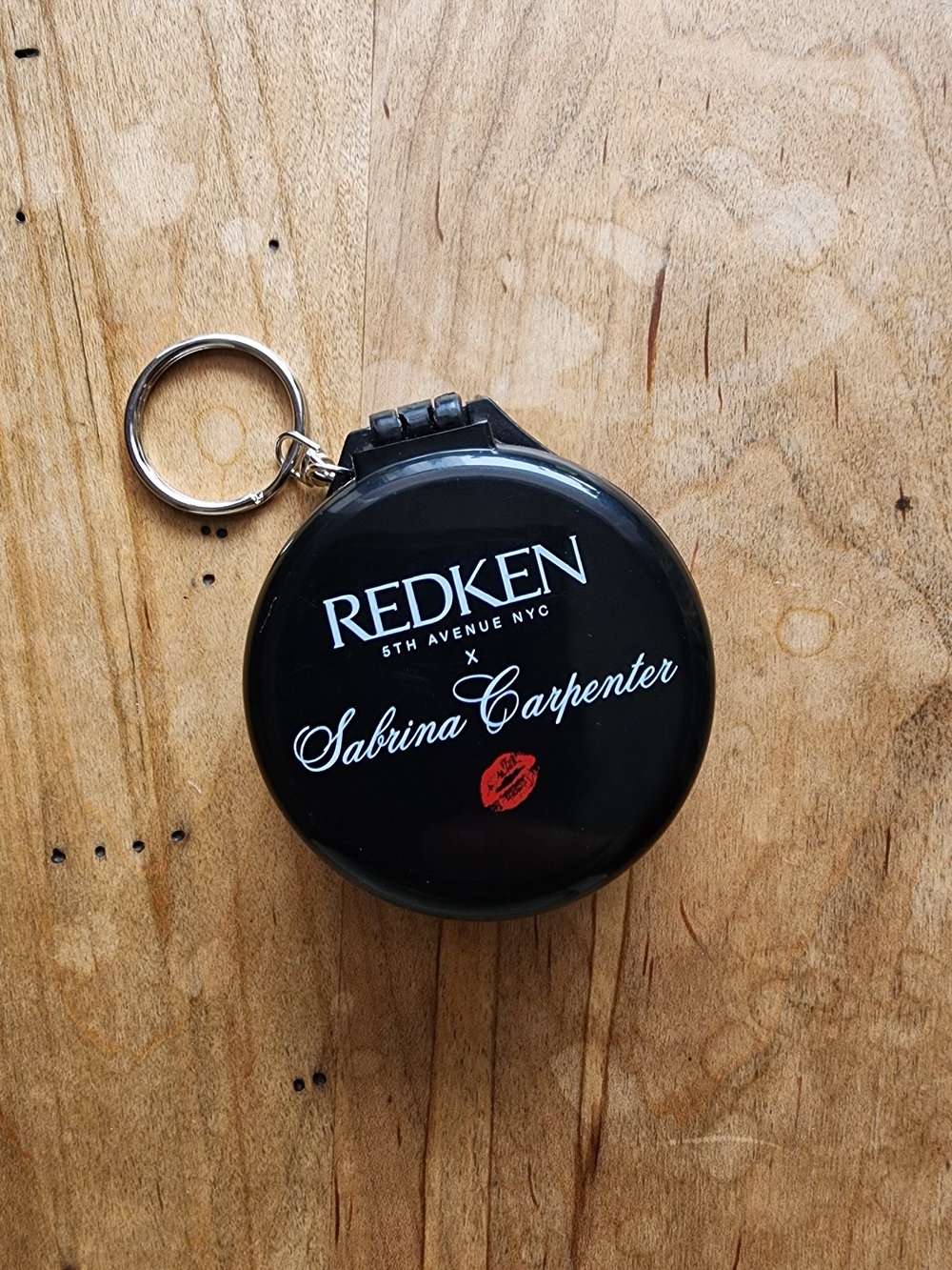 Redken x Sabrina Carpenter Collectible Black Keychain Brush And Mirror.